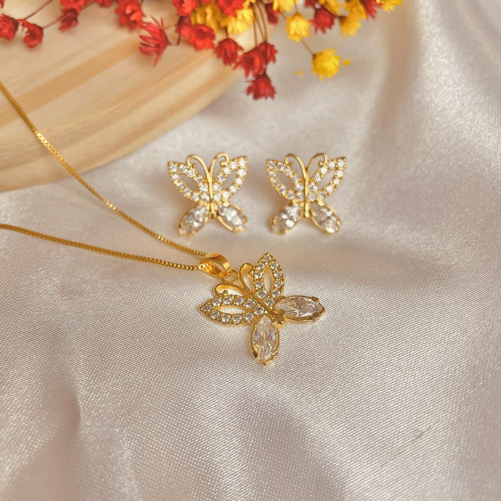 Conjunto de borboleta cravejado com zircônia e banhado a ouro 18k